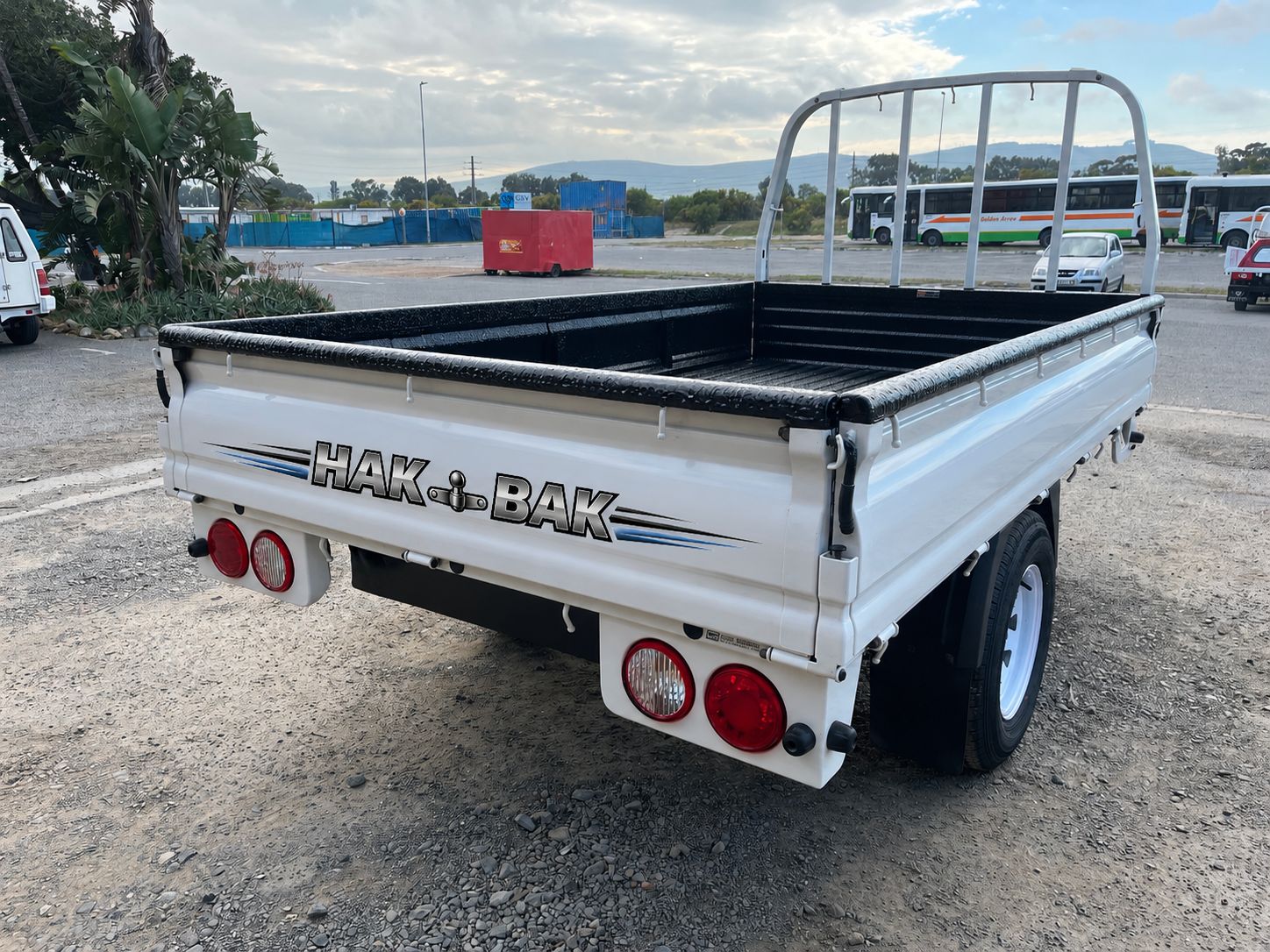 Branded HAK-BAK load bin trailer three-quarter rear view