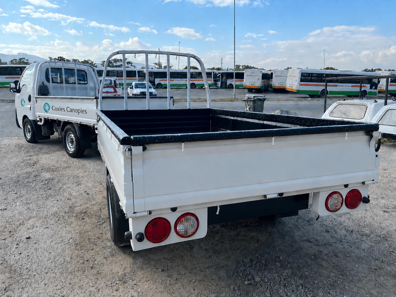Finished white load bin trailer at the depot rear view