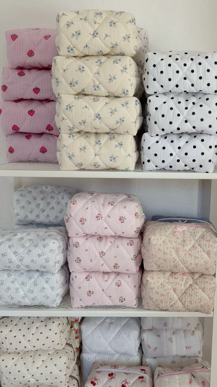 Piled quilted makeup and toiletry bags with floral and polka dot patterns